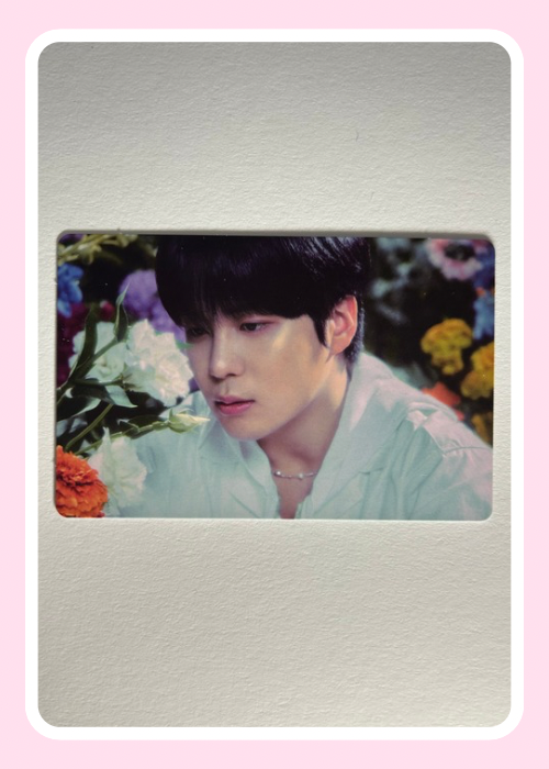 Jongho Ateez  in a light outfit with floral background