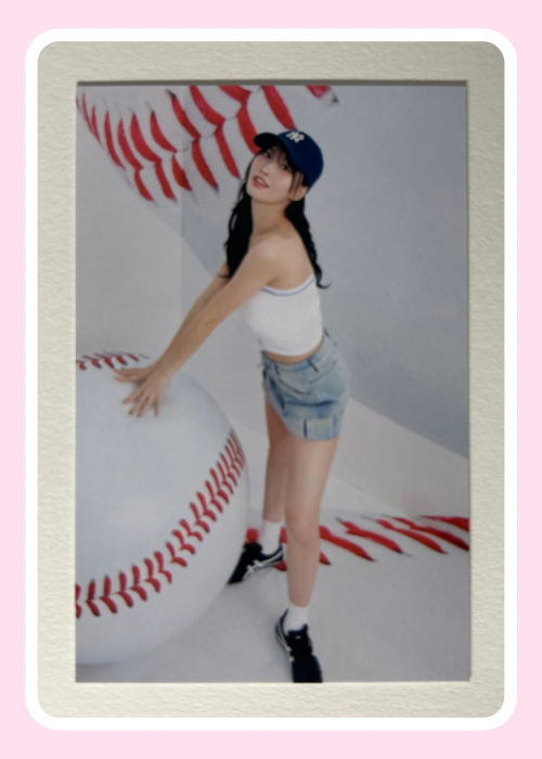 Momo posing next to a large inflatable baseball 