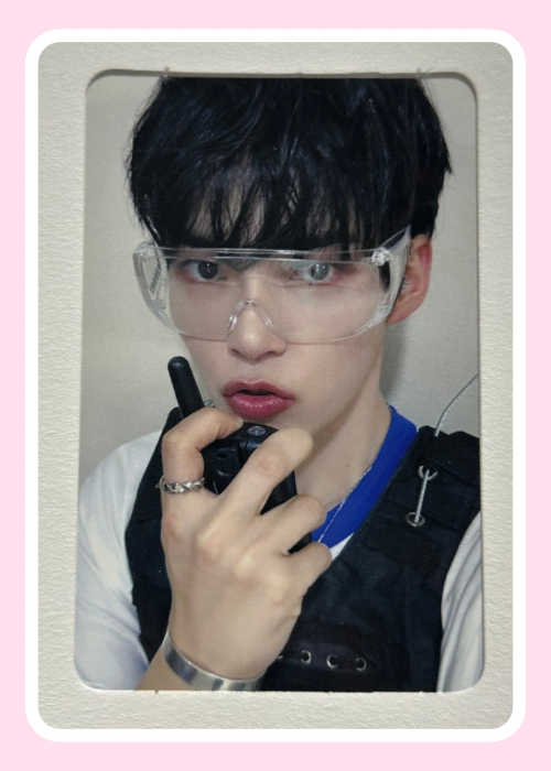 Sung Hanbin from ZB1 holding a walkie-talkie 