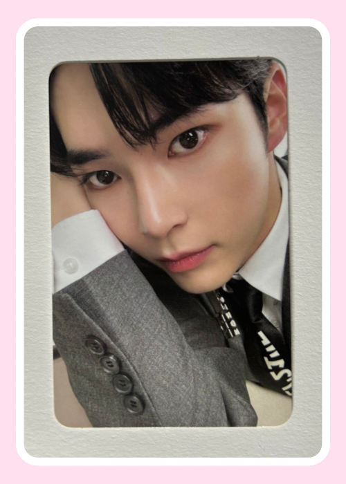 Close-up of Sung Hanbin ZB1 wearing a gray suit 